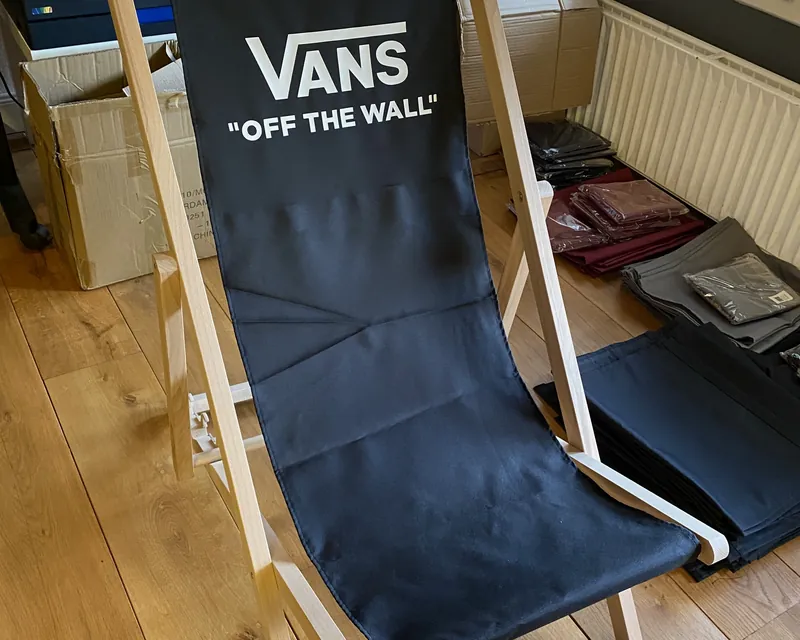 Black deckchair with large logo print