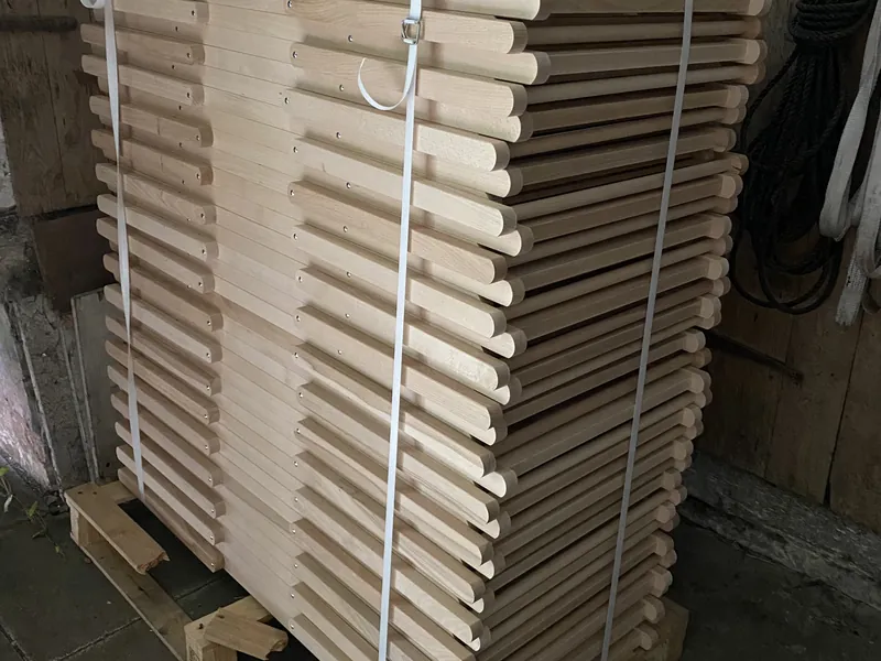 Bundled deckchair frames on a pallet