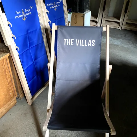 Several custom printed deckchairs for holiday accommodation and tourism businesses