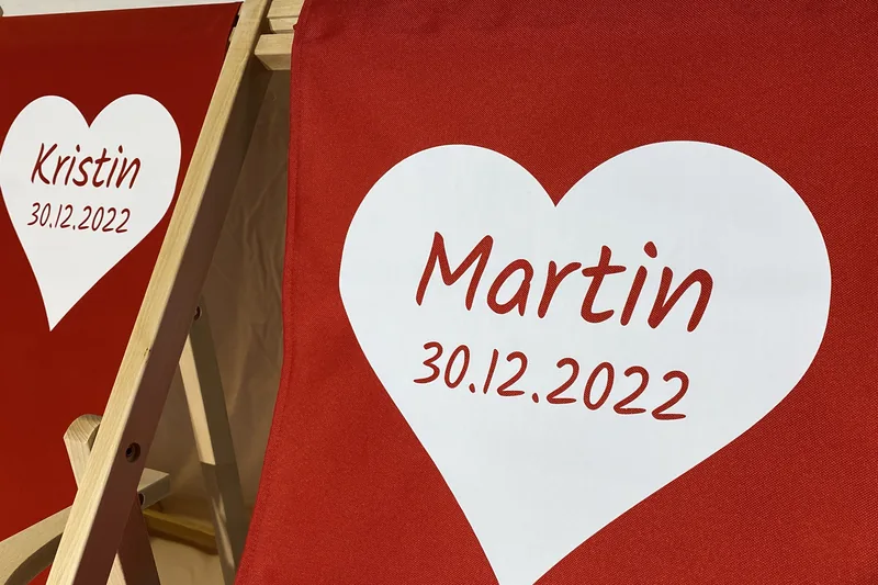 Detail of a wedding deckchair with names and wedding date